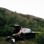 A car is parked on the side of a hill
